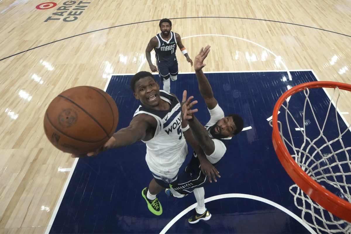 Minnesota Timberwolves star Anthony Edwards (5) elevates over a Dallas Mavericks defender at Target Center. Edwards led his team to a Western Conference Finals appearance last season against Dallas, the eventual conference champions. (Courtesy of the AP)